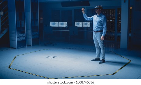 In 3D Content Creating Laboratory Engineer Wearing Professional Virtual Reality Headset Works and Gestures in Augmented Reality. Industrial Software Design Facility