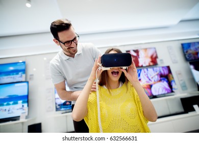 3D Glasses At Tech Store. Couple Having Fun Shopping New Gadget.