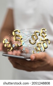 A 3d illustration of golden paragraph symbols connected with wires hovering over a phone in man's hands