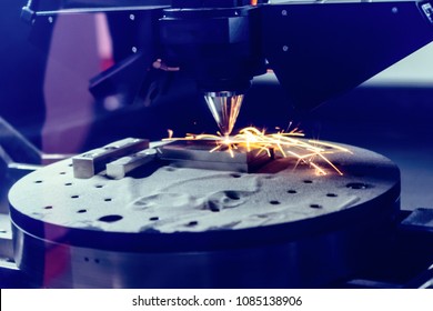 3D metal printer produces a steel part. A revolutionary technology for sintering metal parts. Soft focus. - Shutterstock ID 1085138906