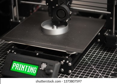 3D Model Being Printed On A 3D Printer With A Metal Headbed And Green LCD.