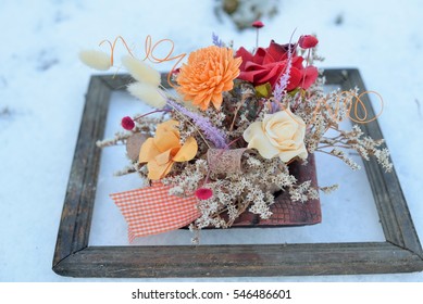 3d Picture In Nature. Dried Flowers In A Very Old Photo Frame On Snow