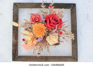 3d Picture In Nature. Dried Flowers In A Very Old Photo Frame On Snow