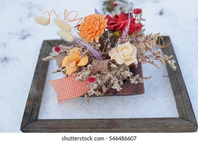 3d Picture In Nature. Dried Flowers In A Very Old Photo Frame On Snow