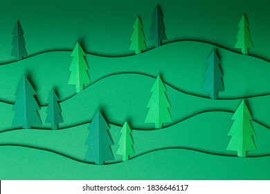 3D Pop Out Christmas Trees Paper Artwork In Green Background. Christmas Tree Paper Cutting Design Card. Top View. Flat Lay