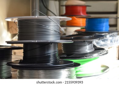 3D printer filament in a workshop.  Photo can be used for the concept of  how to store 3D printer filament and keep it dry. Copy space is on the right side.