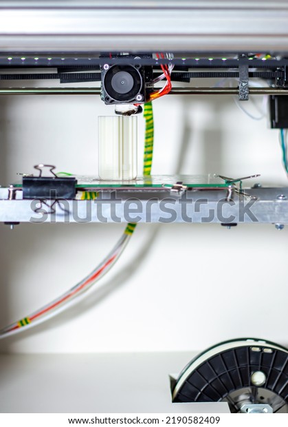 3d printer internal\
structure. Close-up of printing original products and 3d models on\
a 3D printer