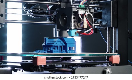 3d Printer printing blue house