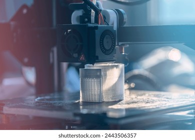 The 3D printer prints white transparent plastic model. modern technology. selective focus - Powered by Shutterstock