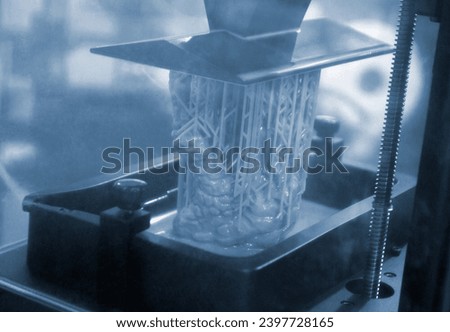 3D printer working process. 3D printing. Stereolithography photopolymerization SLA. Additive manufacturing technology. Liquid materials, hard part, creating layers. 3D model ultraviolet polymerization
