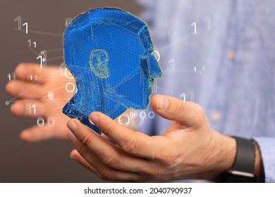 A 3D render of a human head floating above a Caucasian man's hands - artificial intelligence concept