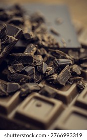 3D render is showing broken dark chocolate bar on wooden tabletop with shards and cocoa dust. Gourmet, indulgence, handcrafted, confectionery, rustic, luxury, texture