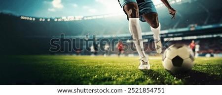 3D render of stadium. Cropped image of male soccer player legs in motion, in blue and white racing toward ball, under bright stadium lights. Concept of sport, tournament, game, event
