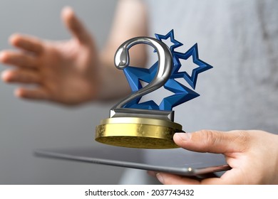 A 3D Rendered 2nd Place Trophy With A Real Person In The Background