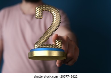 A 3D Rendered 2nd Place Trophy With A Real Person In The Background