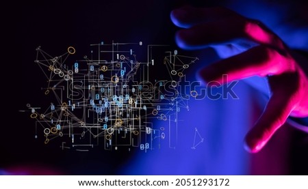 A 3d rendered digital matrix hologram hovering near a man's palm in neon blue light - futuristic tech concept