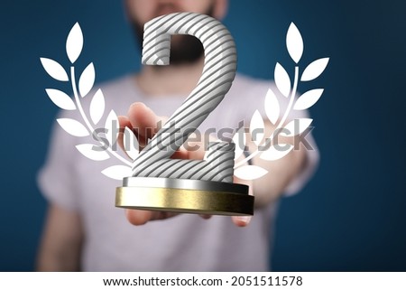 A 3D rendering of the 2nd award prize in a hand