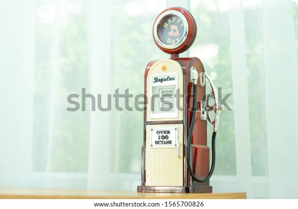 3d rendering of a bright red fuel pump in side
view on white background with a large nozzle attached to it white
pointing upwards. New market possibilities. Oil and gas industry.
Cheapest refuel.
