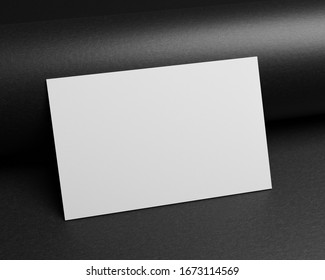 3d Rendering Of A Business Card Mock-up On A Black Paper Background