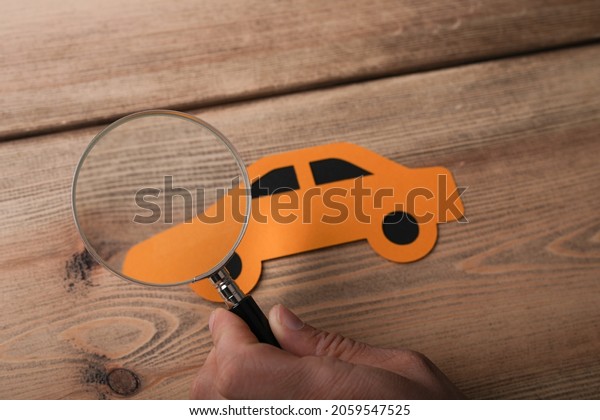 A 3d rendering of digital car technology\
smart in a virtual room on a wooden\
surface