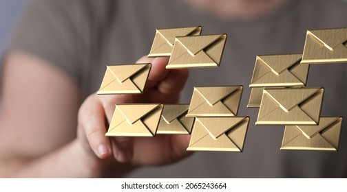 A 3D rendering of digital envelopes with hand touching it from behind- online communication concept