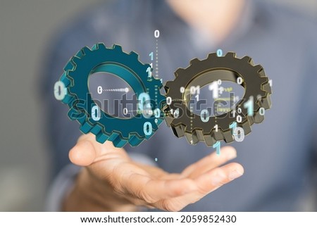 A 3D rendering of digital gears floating over a han-business gear to success concept