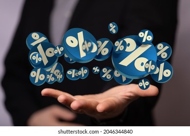 A 3d rendering of digital sales percentage symbols on blue circular desks in a hand