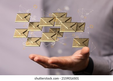 A 3D Rendering Of Floating Email Icons Above A Hand