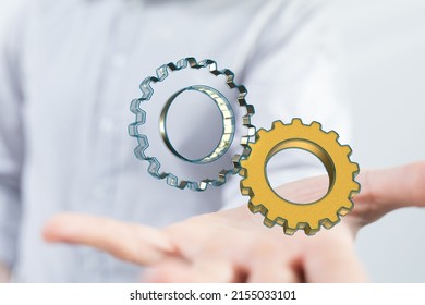 A 3D rendering of gears with binary code hovering over a man's palm - Powered by Shutterstock - Get 15% off with code: PIKWIZARD15