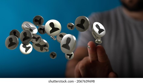 A 3D rendering of a group of floating black people icons on a businessman's hand