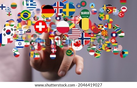 A 3d rendering of national flags in the global communication, messaging, and translation concept with a hand reaching