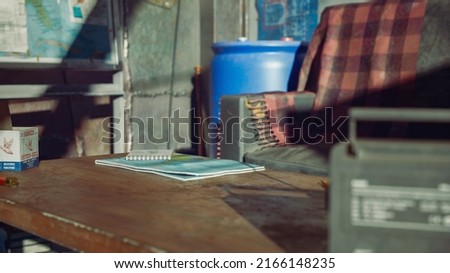 3D Safe house in Apocalypse.Wooden table with radio and Map in sunny day.3D rendering