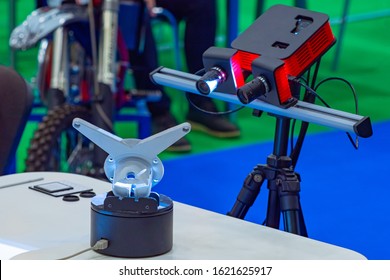 3D scanner. Device scans a metal part. Equipment for creating three-dimensional copies. 3D scanner during operation. Process preparing sketches for a 3D printer. Equipment for scanning volume objects