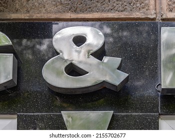 3d Silver Metal Ampersand And Sign at Black Marble