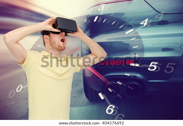 3d technology, virtual reality, entertainment\
and people concept - young man with virtual reality headset or 3d\
glasses playing game playing car racing game over tachometer and\
street race background