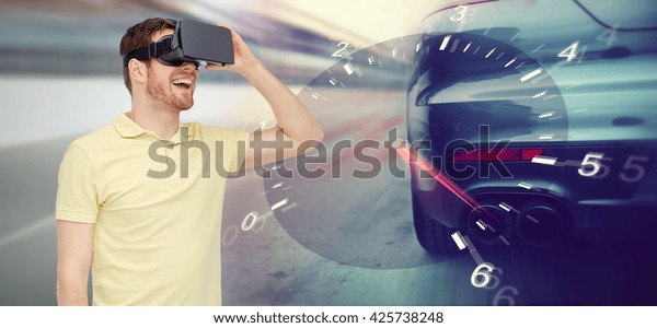3d technology, virtual reality, entertainment\
and people concept - happy young man with virtual reality headset\
or 3d glasses playing car racing game over tachometer and street\
race background