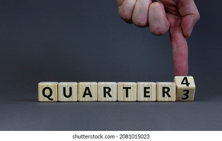 From 3rd To 4th Quarter Symbol. Businessman Turns A Cube And Changes Words 'quarter 3' To 'quarter 4'. Beautiful Grey Table, Grey Background. Business, Happy 4th Quarter Concept, Copy Space.