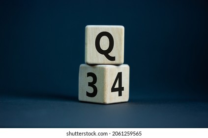 From 3rd To 4th Quarter Symbol. Turned Wooden Cubes And Changed Words 'Q3' To 'Q4'. Beautiful Grey Table, Grey Background. Business, Happy 4th Quarter Q4 Concept, Copy Space.