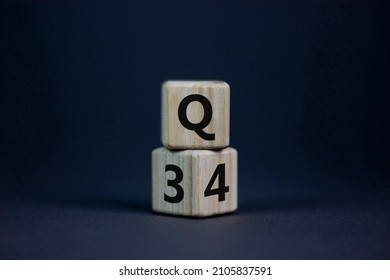 From 3rd To 4th Quarter Symbol. Turned Wooden Cubes And Changed Words 'Q3' To 'Q4'. Beautiful Grey Table, Grey Background. Business, Happy 4th Quarter Q4 Concept, Copy Space.