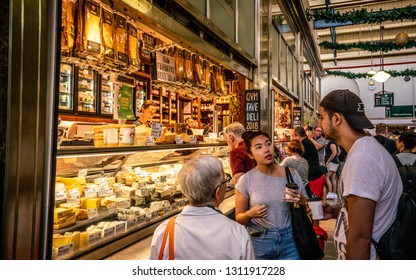 3rd January 2019, Melbourne Victoria Australia : People Drinking Coffee In Front Of A Cheese Shop Inside Queen Victoria Market Aisle In Melbourne Australia