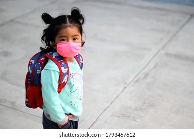 3-year-old Latina Girl With Covid-19 Protection Mask And Backpack For Back To School, New Normal