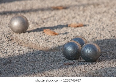 4 Boule Balls Lying In The Sand