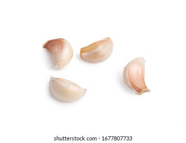 4 cloves garlic isolated on the white background with clipping paths.