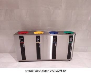 4 Colors Metal Stainless Steel Recycle Bins And Trash Bin With Icons. Office Waste Management. Keep Environment Clean Design Concept Image With Empty Space For Text