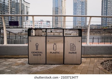 4 Colors metal stainless steel recycle bins and trash bin with icons. Office waste management. Keep environment clean design concept image with empty space for text. High quality photo