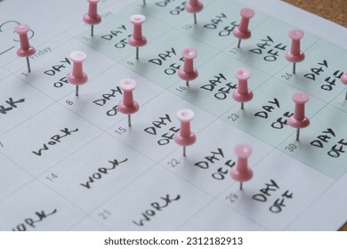 4 day work week printed calendar with pink pins on three days off in week weekend days four day working week concept. Modern approach doing business short workweek. Effectiveness of employees