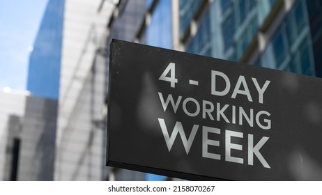 4 - Day working week on a black city-center sign in front of a modern office building	 - Shutterstock ID 2158070267