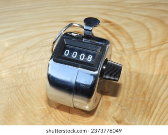 4 digit hand tally click counter on number 8 - Powered by Shutterstock