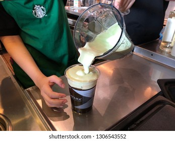 4 Feb 2019; Nonthaburi Thailand: Starbucks Staff Pouring Matcha Cold Foam Iced Amaricano Coffee Cup At Starbucks Coffee Shop