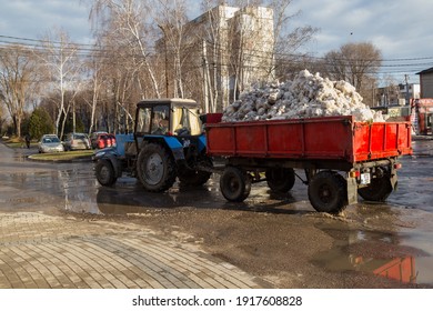 4 February 2021 Balti Moldova Tractor With A Trailer Removes Snow From The City. Cleaning Of The Territory By Municipal Services